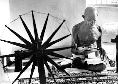 Mahatms Gandhi with spinning wheel