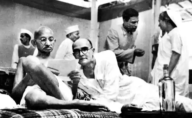 Gandhi with Mahadev Desai, 1942