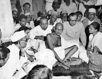 Gandhi listens to Moslems during the height of the warfare which followed the partition of India in 1947